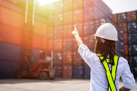 Woman Foreman control loading Containers box Stock Photos