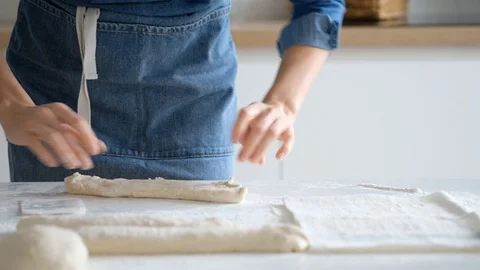 Woman forms balls for bread from raw dough with her own hands. Bread 4K Stock Footage 121527323