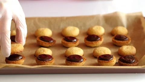 A woman forms a cookie with chocolate Stock Footage 88733181