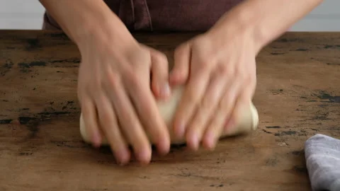 A woman forms a yeast wheat bread. Toast bread. 4K. Stock Footage 141341704