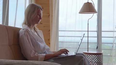 Woman freelancer working remotely using laptop at home Stock Footage 345751934