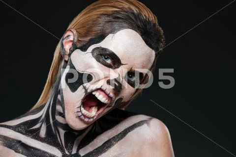 Woman with frightened halloween makeup and opened mouth shouting Stock Photos