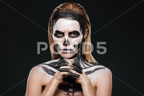 Woman with frightening skeleton makeup Stock Photos