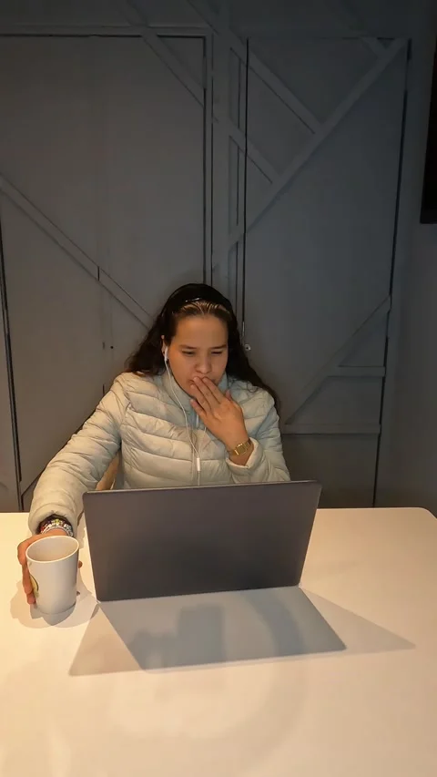 Woman in front of computer smiles Stock Footage 221868381
