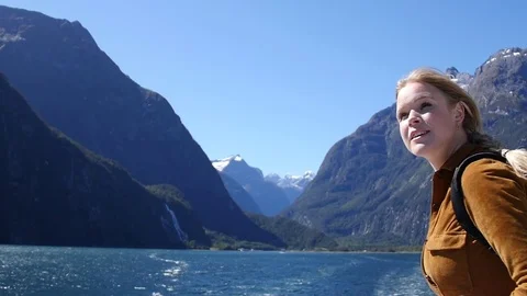 Woman in Front of Mountain Lake Stock Footage