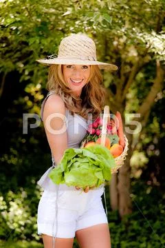 Woman with fruit basket Stock Photos