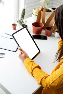 Woman gardener hands holding digital tablet with blank screen Stock Photos