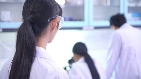 Woman genetic engineer at work in lab. Stock Footage 92394637