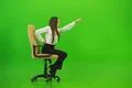 The woman gesture on the chair on the green background Photo