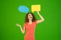 The woman gesture near a dialog signs on the green background Photo