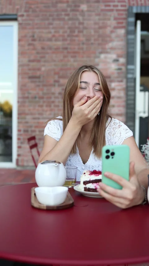 Woman gestures and smiles while flirting with man during online cafe date 스톡 동영상 344448861