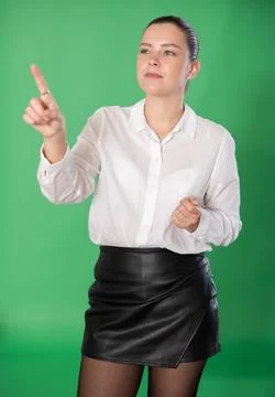 Woman gesturing with her hands while controlling virtual screen with artificial 스톡 사진