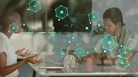 Woman gesturing, initiating teal node network across table while man tapping Stock Footage 333369035