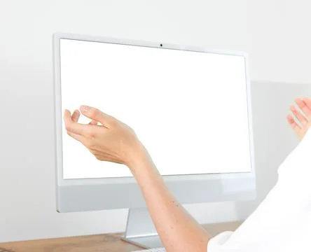 Woman gesturing with open hands in front of blank computer screen mockup. F.. Stock Photos