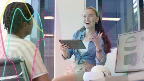 Woman gesturing to open talk, showing tablet while tech graphs overlaying Stock Footage 334693811