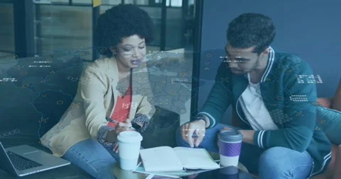 Woman gesturing toward notebook and initiating business data overlay with Stock Footage 327060975