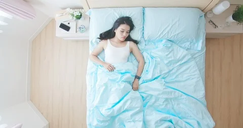 Woman get up from bed Stock Footage 119669171
