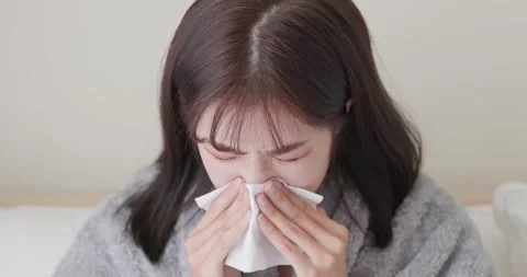 Woman gets a cold Stock Footage 159198623