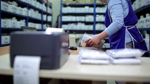 Woman gets out of the box with packing cloth. Stock Footage