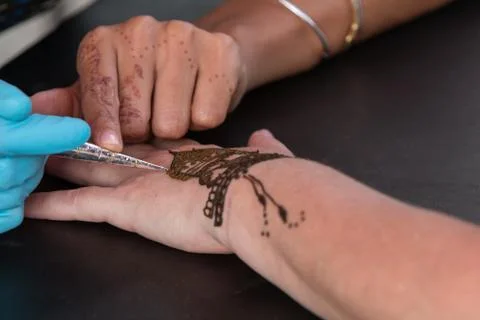 Woman Gets Temporary Henna Tattoo On Hand Stock Photos