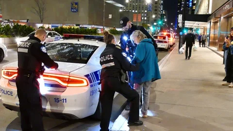 Woman getting arrested Stock Footage 120064001