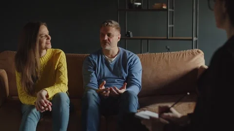 Woman is getting mad while her husband talking to family psychologist about Stock Footage 242611023