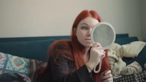 Woman getting ready indoors. Intimate scene of woman grooming herself quietly Stock Footage 346559028