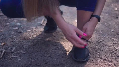 Woman getting ready to run Stock Footage 79024570