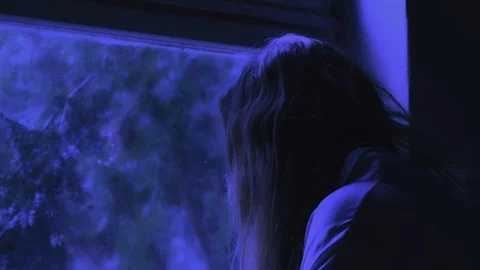 Woman ghost standing next to the window on full moon night. Stock Footage 121870836