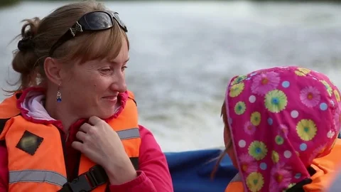 The woman with the girl floating in a boat Stock Footage 78717841