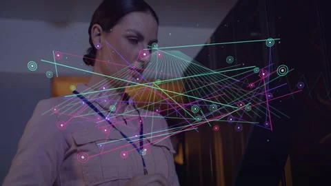 Woman glancing tablet, tapping and swiping in server aisle, generating live Stock Footage 332704665