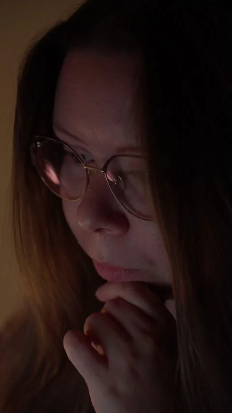 Woman in Glasses Looking at Computer Screen in Warm Light Stock Footage 344950005