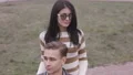 The woman in glasses standing with a handicapped person 4k or 4k+ Resolution