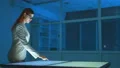 The woman in glasses working with a virtual screen 4k or 4k+ Resolution