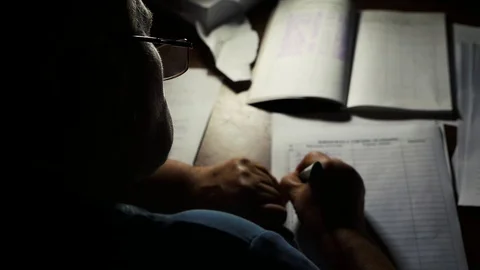A woman in glasses writes something Stock Footage 80351111