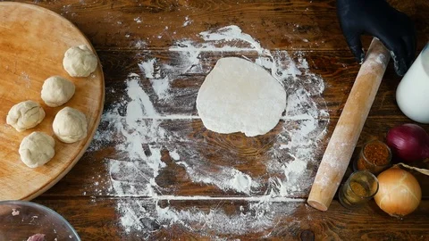 Woman in  gloves adding minced meat to dough for making pie or khinkali Stock Footage 109939863