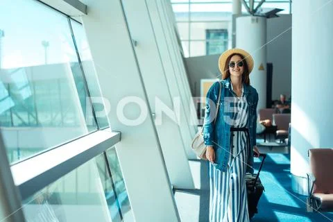 Woman go travel with suit case at airport Stock Photos