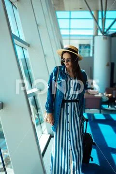 Woman go travel with suit case at airport Stock Photos