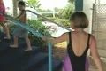 Woman going up waterslide slope Footage
