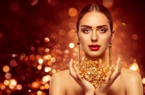 Woman Gold Beauty, Fashion Model Holding Golden Jewelry in Hands Stock Photos