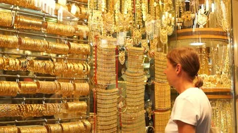 Dubai, UAE , 2022 - most expensive shop items - luxury golden dresses and  outfits for woman on shop display in gold souk in old Dubai 16191194 Stock  Video at Vecteezy