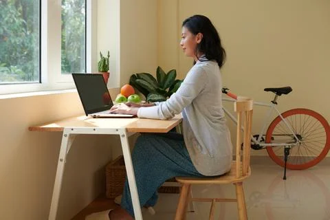 Woman with Good Posture Working on Laptop Stock Photos