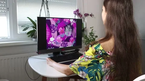 A woman, graphic designer, illustrator is doing the illustration Stock Footage 157304523