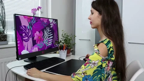 A woman, graphic designer, illustrator is doing the illustration Stock Footage 157304530