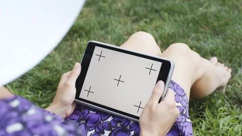 Woman on grass with tablet Stock Footage 77561052