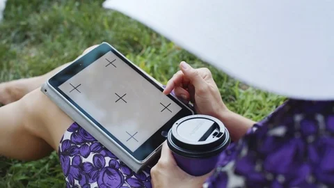 Woman on grass with tablet Stock-Footage 77564257