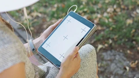 Woman on grass with tablet Stock Footage 77621445