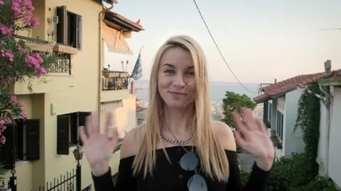 Woman greeting to camera. Video stock 200008375