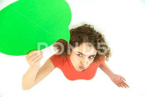 The woman grimace near the green dialog sign. View from above Stock Photos