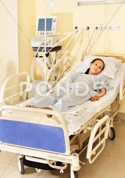 Woman on gurney in operating room. Stock Photos